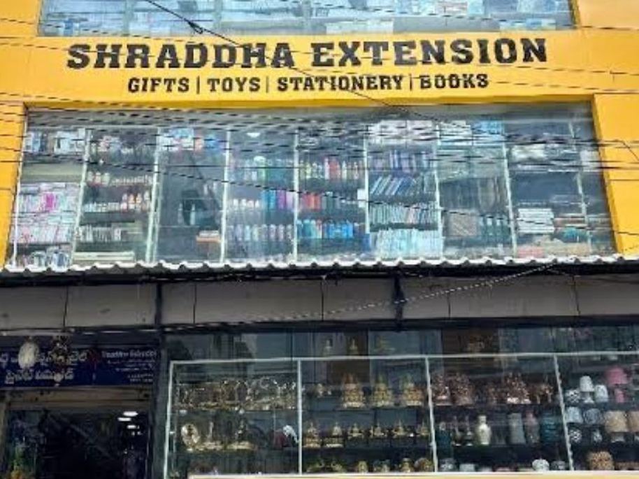 Shraddha Extension A.S. Rao Nagar store front, a yellow building with the store signboard